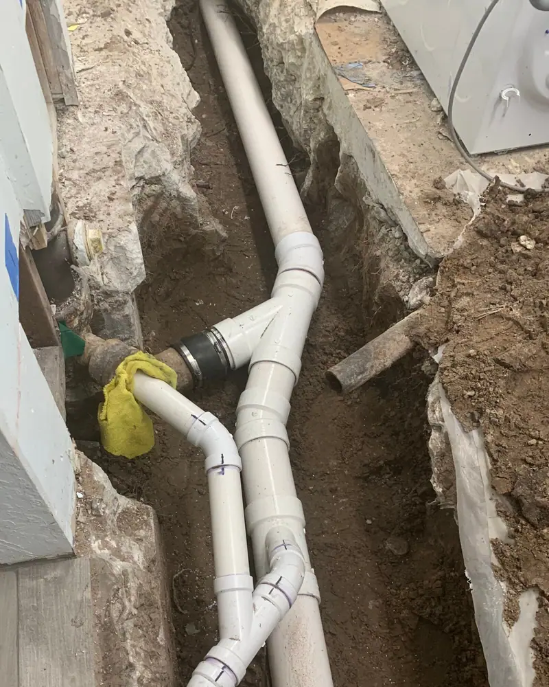New PVC drain fittings in an open trench